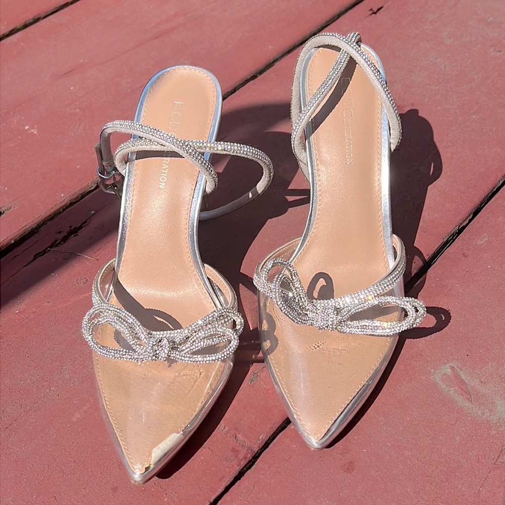 BCBG Genertation clear heel with rhinestones.